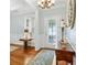 Inviting entryway with hardwood floors, decorative rug and lighting at 601 Laurel Xing, Canton, GA 30114