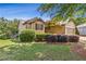 Charming one-story home with manicured lawn and mature trees at 601 Laurel Xing, Canton, GA 30114