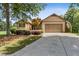 Charming one-story home with manicured lawn, mature trees, and two-car garage at 601 Laurel Xing, Canton, GA 30114