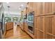 Spacious kitchen with stainless appliances, granite countertops, and hardwood floors at 601 Laurel Xing, Canton, GA 30114