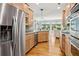 Updated kitchen with stainless steel appliances, and a view into the living room at 601 Laurel Xing, Canton, GA 30114