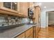Stylish kitchen with stainless appliances, granite counters and backsplash, and wood floors at 601 Laurel Xing, Canton, GA 30114