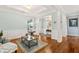 Bright living room featuring hardwood floors, large windows, and classic trim for added character at 601 Laurel Xing, Canton, GA 30114
