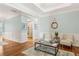 Inviting living room with elegant trim work, stylish furniture, and gleaming hardwood floors at 601 Laurel Xing, Canton, GA 30114