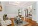 Comfortable living room with hardwood floors, decorative rug and lighting at 601 Laurel Xing, Canton, GA 30114