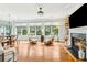 Sunlit living room features hardwood floors, large windows, fireplace, and comfortable seating area at 601 Laurel Xing, Canton, GA 30114