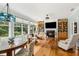 Inviting living space featuring a fireplace, built-ins, and a view of the outdoors at 601 Laurel Xing, Canton, GA 30114
