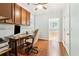 Bright home office with built in desk, wood floors, overhead cabinets, and natural light at 601 Laurel Xing, Canton, GA 30114