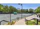 Well-maintained tennis courts surrounded by mature trees and green canopies at 601 Laurel Xing, Canton, GA 30114