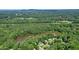Beautiful aerial view of the lake community, showing the house surrounded by trees at 109 Lake Latimer Ne Cv, Kennesaw, GA 30144
