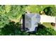 An aerial shot of the home's roof and driveway, nestled amongst trees at 109 Lake Latimer Ne Cv, Kennesaw, GA 30144