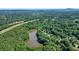 Aerial view of the wooded community featuring a large lake at 109 Lake Latimer Ne Cv, Kennesaw, GA 30144