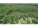Aerial view of property showcasing the home's proximity to a serene lake at 109 Lake Latimer Ne Cv, Kennesaw, GA 30144