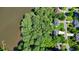 An aerial view of a wooded lot on the water, showing the property's proximity to other homes at 109 Lake Latimer Ne Cv, Kennesaw, GA 30144