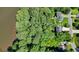 An aerial view of a wooded lot on the water, outlining property lines at 109 Lake Latimer Ne Cv, Kennesaw, GA 30144