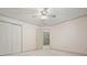 Clean bedroom with double closets, a ceiling fan, and a door to the hallway at 109 Lake Latimer Ne Cv, Kennesaw, GA 30144
