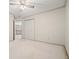 Spacious bedroom featuring a ceiling fan, closet, and views to upstairs hall at 109 Lake Latimer Ne Cv, Kennesaw, GA 30144