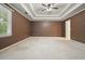 Large bedroom features crown molding, ceiling fan, and a window allowing plenty of natural light at 109 Lake Latimer Ne Cv, Kennesaw, GA 30144
