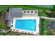 Aerial view of a large community pool with lounge areas and tennis courts at 109 Lake Latimer Ne Cv, Kennesaw, GA 30144