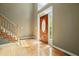 Bright entryway boasts hardwood floors, a staircase and an elegant front door with sidelights and transom window at 109 Lake Latimer Ne Cv, Kennesaw, GA 30144