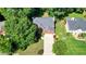 Aerial view of the charming brick home with well-manicured front yard and driveway at 109 Lake Latimer Ne Cv, Kennesaw, GA 30144