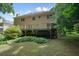 View of the back of the house showcasing the deck and backyard at 109 Lake Latimer Ne Cv, Kennesaw, GA 30144