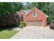Charming two-story brick home with attached garage and lush landscaping at 109 Lake Latimer Ne Cv, Kennesaw, GA 30144