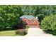 Well-maintained two-story brick home with a two-car garage and manicured landscaping at 109 Lake Latimer Ne Cv, Kennesaw, GA 30144
