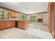 Bright kitchen with granite countertops, center island, wood cabinetry and large windows to the backyard at 109 Lake Latimer Ne Cv, Kennesaw, GA 30144