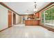 Kitchen with hardwood cabinets, stainless steel appliances, tile flooring, and center island at 109 Lake Latimer Ne Cv, Kennesaw, GA 30144