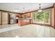 Kitchen with stainless steel appliances, a kitchen island, wood cabinetry and access to outdoor patio at 109 Lake Latimer Ne Cv, Kennesaw, GA 30144