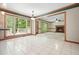 Open floor plan from kitchen to a living room with a fireplace and large backyard view at 109 Lake Latimer Ne Cv, Kennesaw, GA 30144