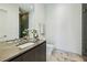 Stylish bathroom featuring a vessel sink, modern fixtures, and a glass-enclosed shower at 1301 Peachtree Ne St # 4L, Atlanta, GA 30309