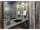 Modern bathroom with double sinks, sleek countertops, decorative lighting, and custom faucet at 1301 Peachtree Ne St # 4L, Atlanta, GA 30309