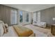 Spacious bedroom featuring large windows with city views and stylish gray curtains at 1301 Peachtree Ne St # 4L, Atlanta, GA 30309