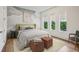 Comfortable bedroom with three windows and a soft color palette at 1301 Peachtree Ne St # 4L, Atlanta, GA 30309
