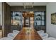 Elegant dining area with custom built-ins and views into the kitchen at 1301 Peachtree Ne St # 4L, Atlanta, GA 30309