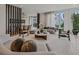 Open living room with hardwood floors, neutral decor, and views into the dining room at 1301 Peachtree Ne St # 4L, Atlanta, GA 30309