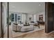 Spacious living room with hardwood floors and modern furniture and city views at 1301 Peachtree Ne St # 4L, Atlanta, GA 30309