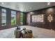 Modern lounge featuring dark wood paneling, contemporary art, and stylish tables at 1301 Peachtree Ne St # 4L, Atlanta, GA 30309