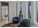 Bright sitting room with large windows, decorative vase, and comfortable seating at 1301 Peachtree Ne St # 4L, Atlanta, GA 30309