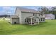 Backyard with a grassy lawn and a patio with outdoor seating, and green house siding at 2 Whites Pond Rd, Moreland, GA 30259