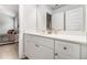 Bright secondary bathroom featuring a single vanity and a large mirror at 2 Whites Pond Rd, Moreland, GA 30259