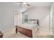Bedroom featuring carpet, a ceiling fan, a window, and an ensuite bathroom at 2 Whites Pond Rd, Moreland, GA 30259