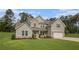Beautiful two-story home with a manicured lawn, showcasing its appealing brick and siding facade at 2 Whites Pond Rd, Moreland, GA 30259