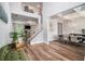 Bright and airy foyer with hardwood floors, staircase and sight lines to the living and dining area at 2 Whites Pond Rd, Moreland, GA 30259