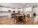 Bright, open kitchen with white cabinets, stainless steel appliances, and a large island with seating at 2 Whites Pond Rd, Moreland, GA 30259