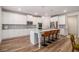 Spacious kitchen featuring white cabinets, a center island with seating, and stainless steel appliances at 2 Whites Pond Rd, Moreland, GA 30259