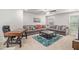 Cozy living room with large sectional couch and office area at 2 Whites Pond Rd, Moreland, GA 30259
