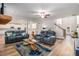 Cozy living room with hardwood floors, modern furniture, and an open layout to the kitchen at 2 Whites Pond Rd, Moreland, GA 30259